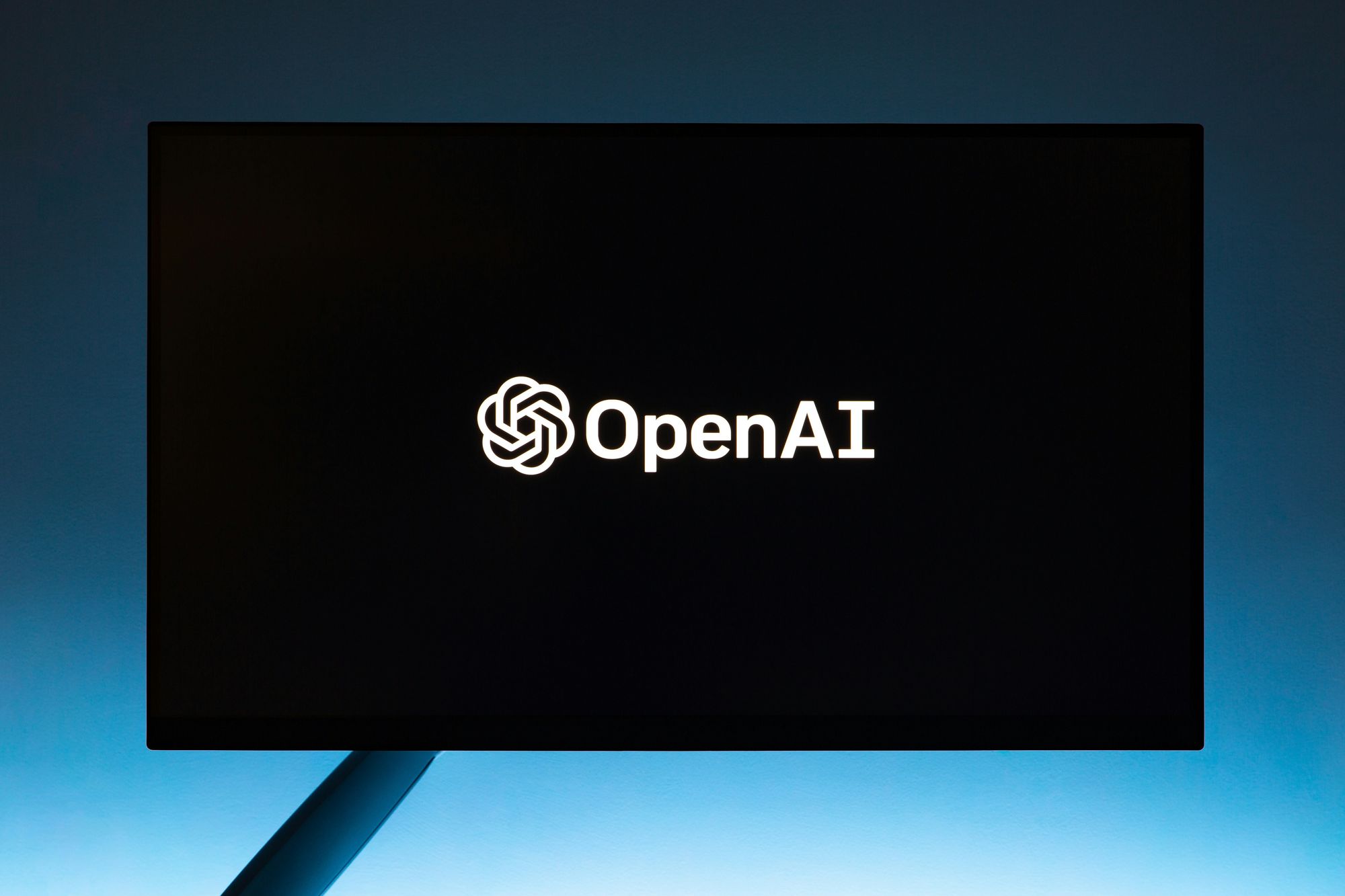 OpenAI logo in white with black background for OpenAI Text To Speech